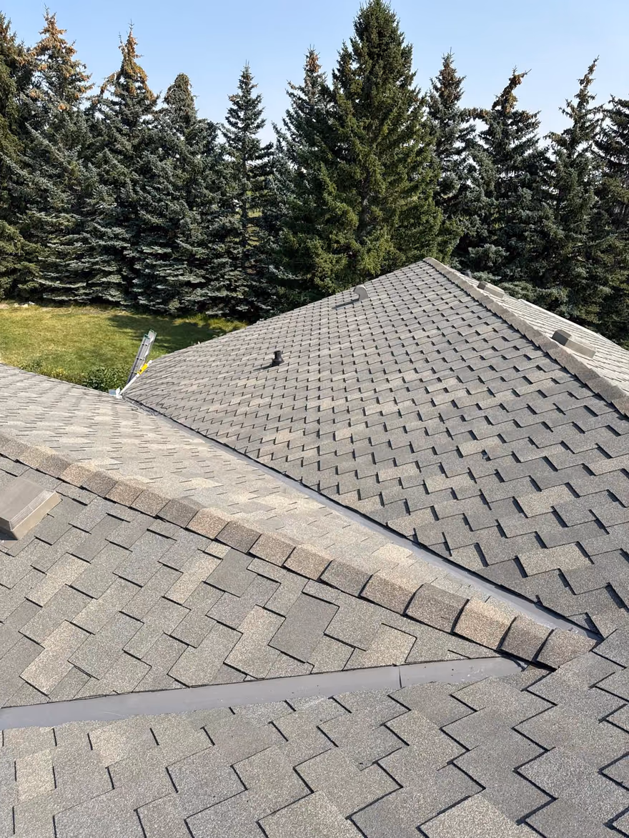 Aerial overview weathered asphalt shingle roof planes
