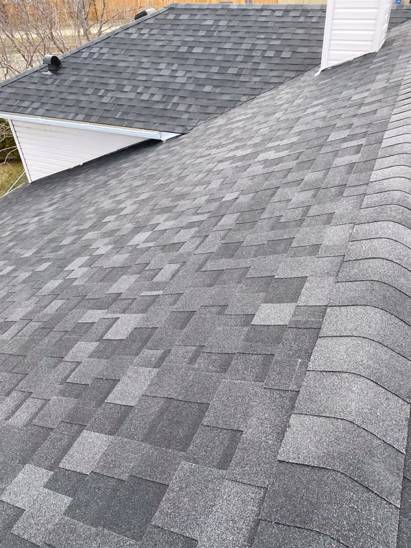 Aerial view finished charcoal shingles and valley