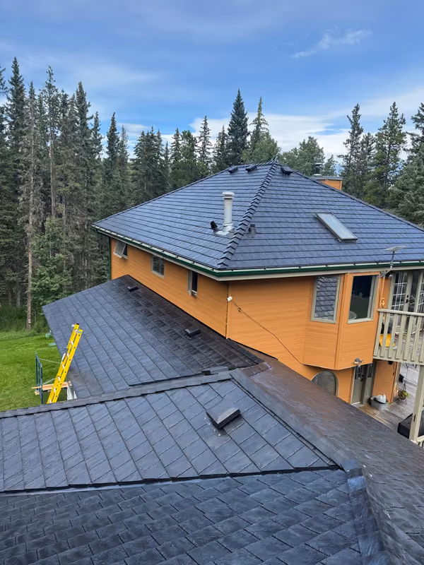 Aerial view synthetic slate roof orange two storey home