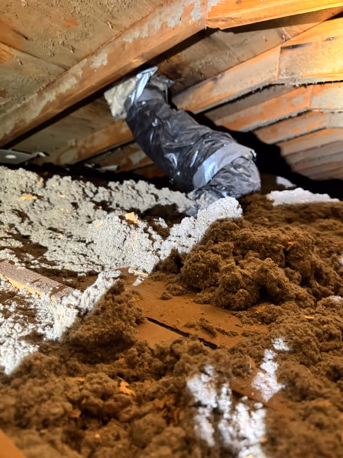 Attic flex duct over uneven loose fill insulation