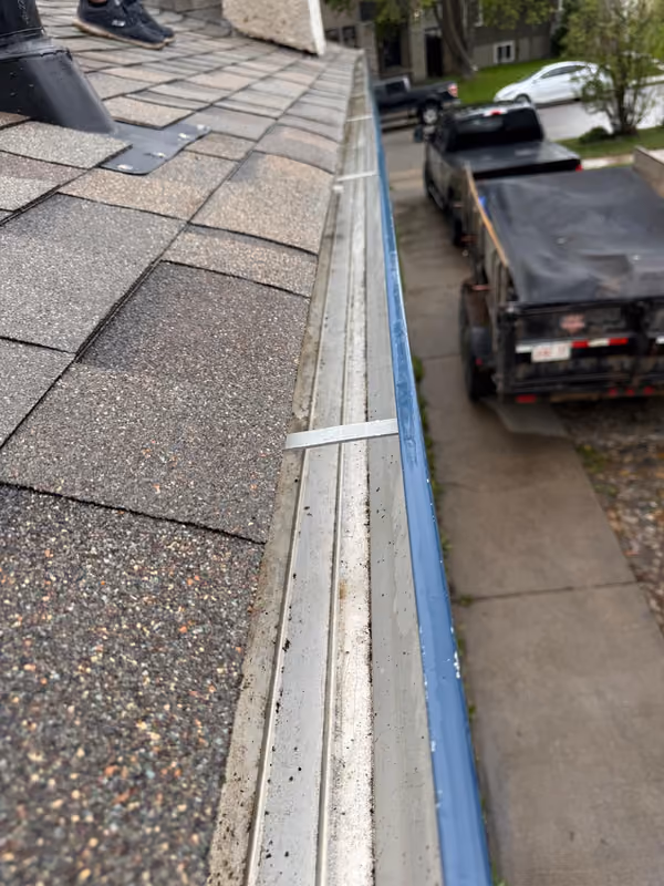 Close up gutter and drip edge above driveway