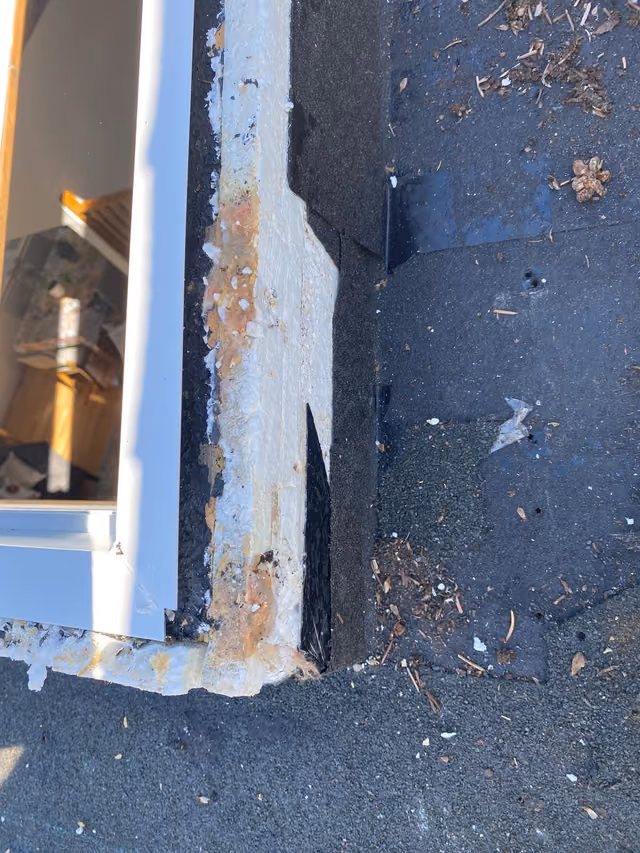 Close up rusted skylight flashing and debris