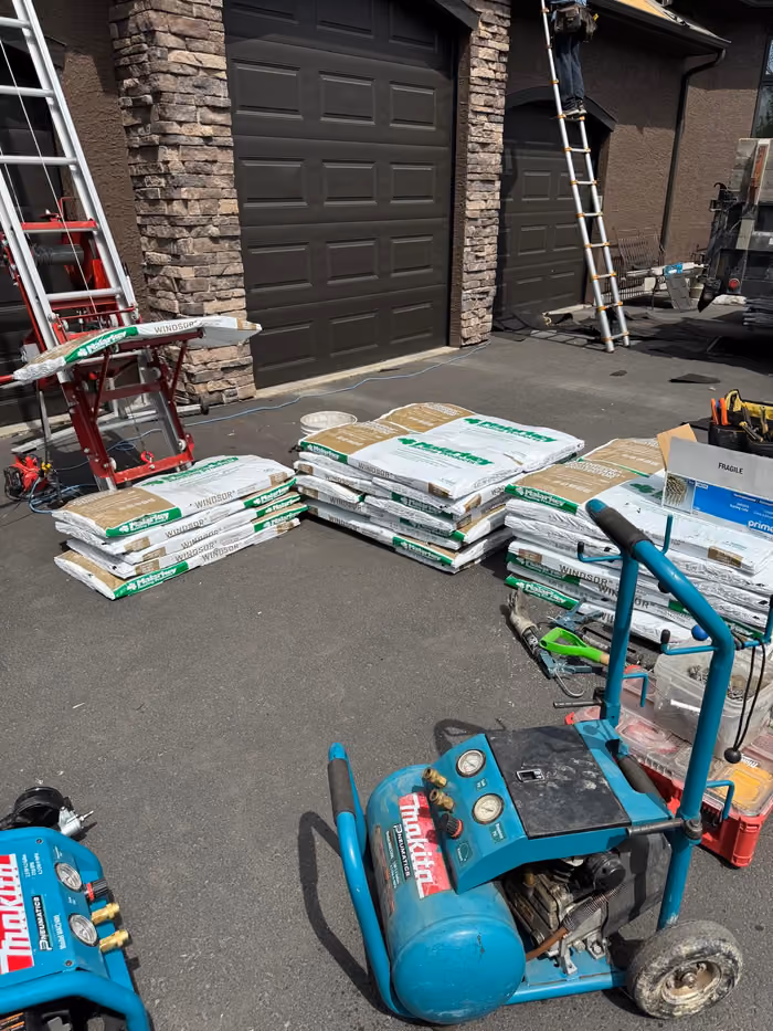 Compressors ladders and bundles staged at jobsite