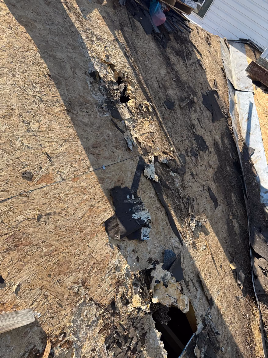 Deteriorated valley deck with open rot holes