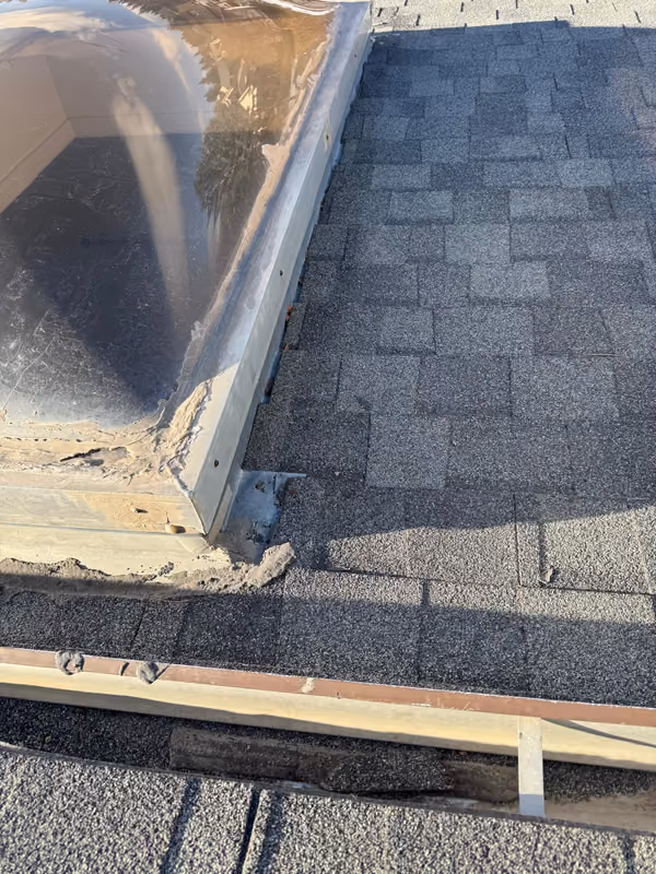 Dome skylight curb with failed sealant and flashing