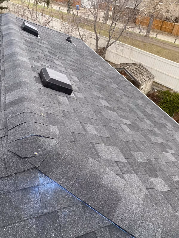 Finished charcoal shingles with two box vents