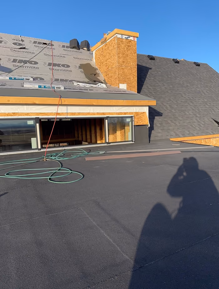 Flat roof deck overlooking garage opening new build