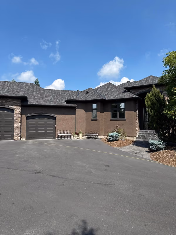 Ground level view finished shingle roof large bungalow