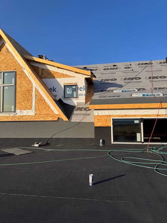 Membrane deck with torch tools and house wrap gable