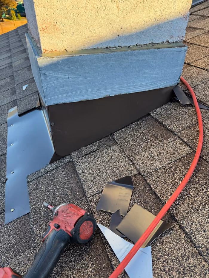 New chimney chase base flashing installed with tools
