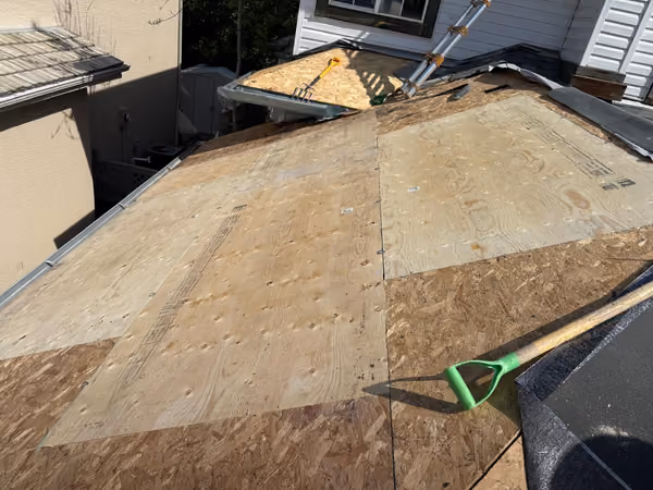 New plywood deck installed on garage roof