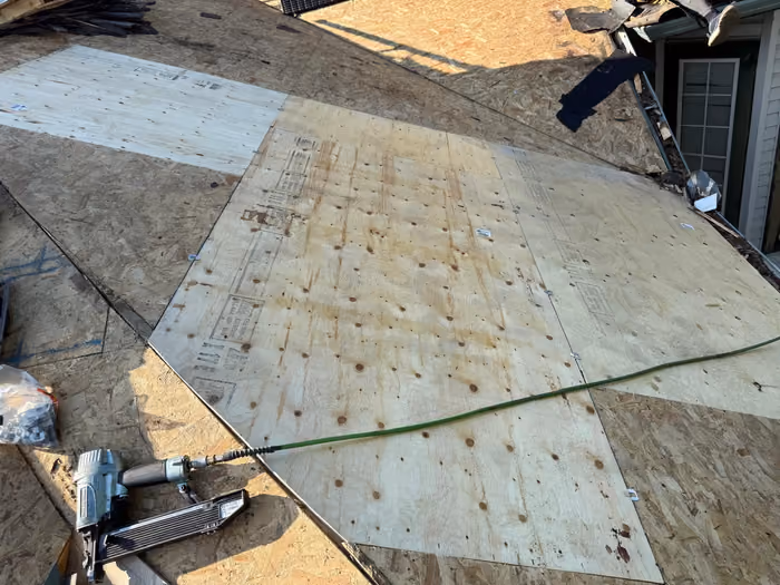 New plywood sheathing replacing rotted roof deck