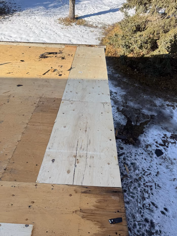 Replacement plywood panels installed on stripped deck