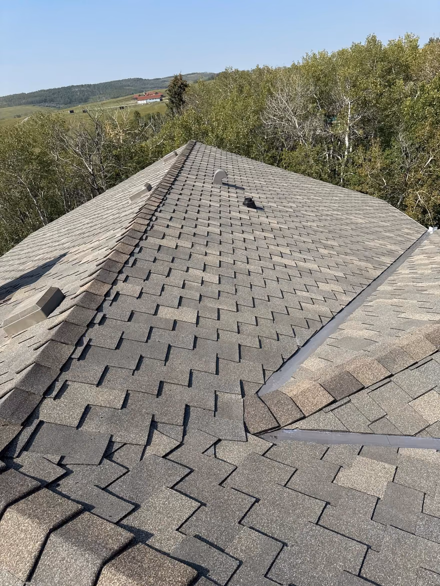 Ridge view finished shingles with hip cap rural home