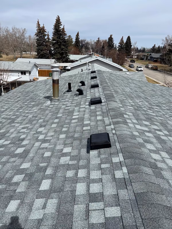 Ridge view finished shingles with vents and flue