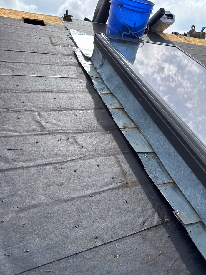 Skylight curb with new metal flashing installed