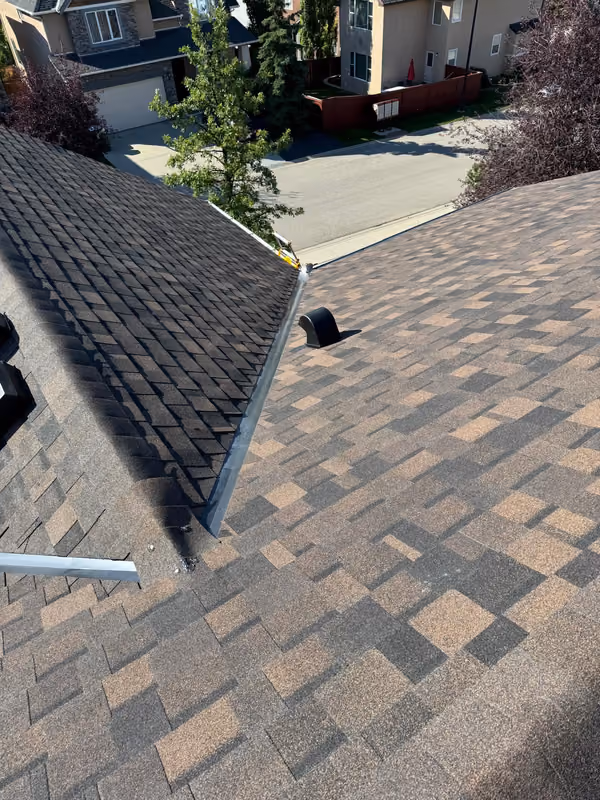 Weathered brown shingle hip roof condition overview