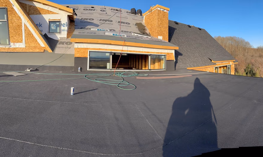 Wide view flat membrane deck and shingled roof sections